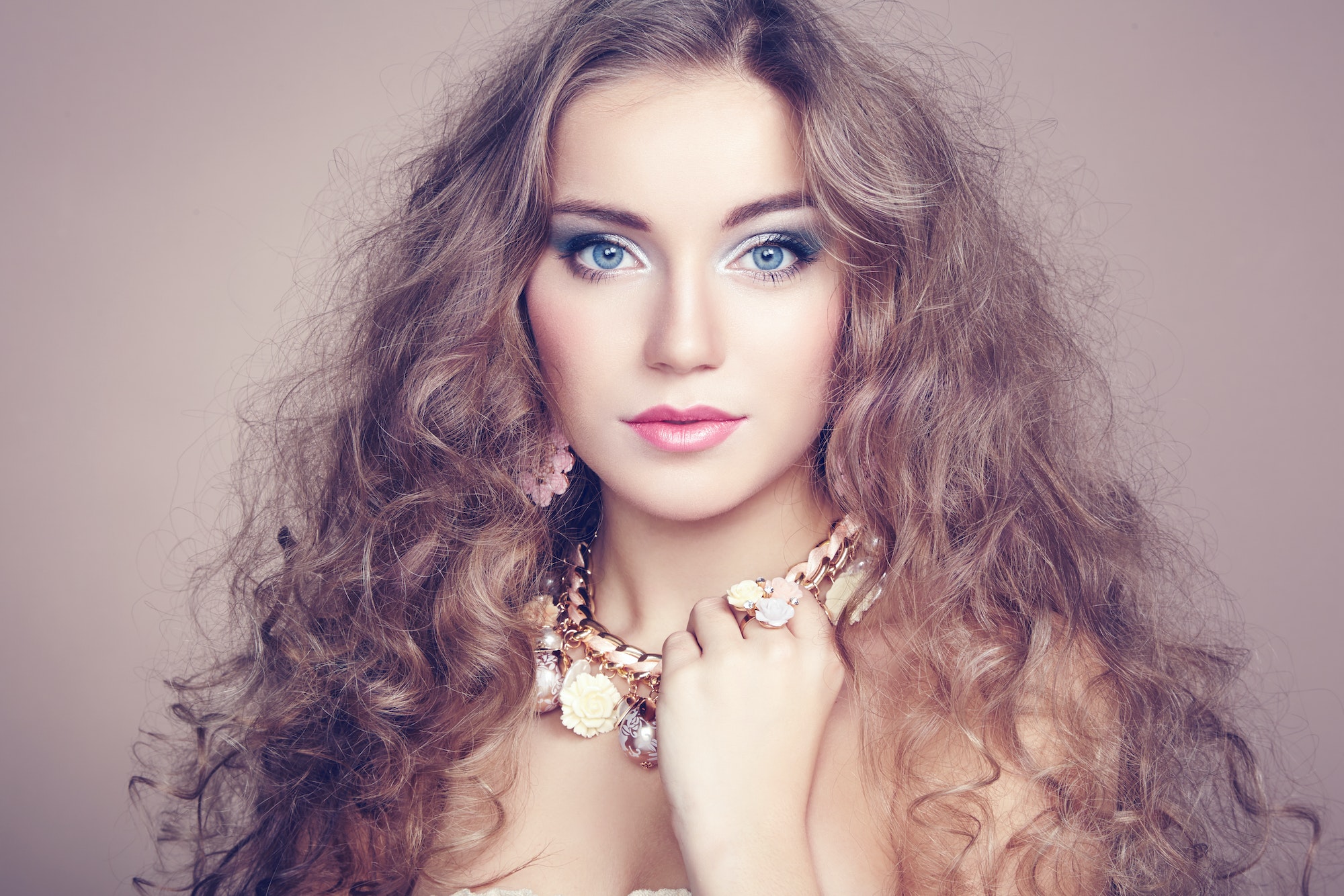 Portrait of young beautiful woman with jewelry